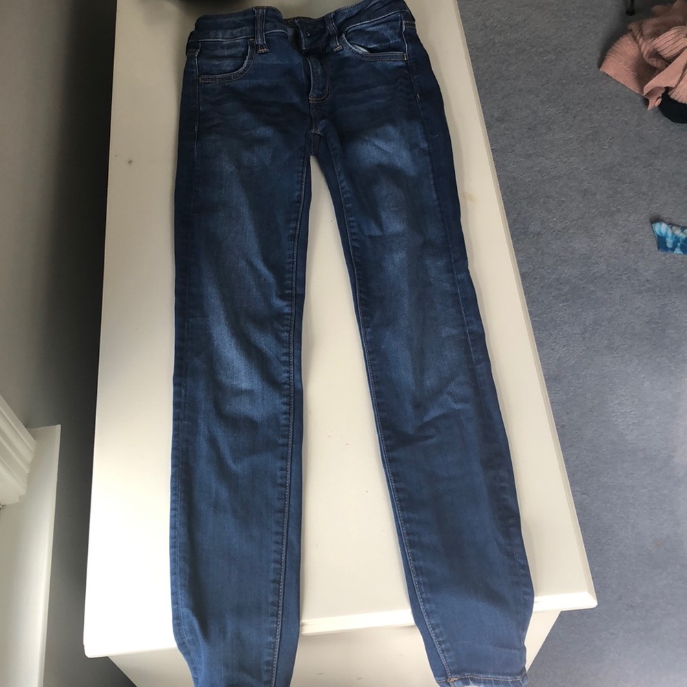 american eagle super stretch medium wash jeggings